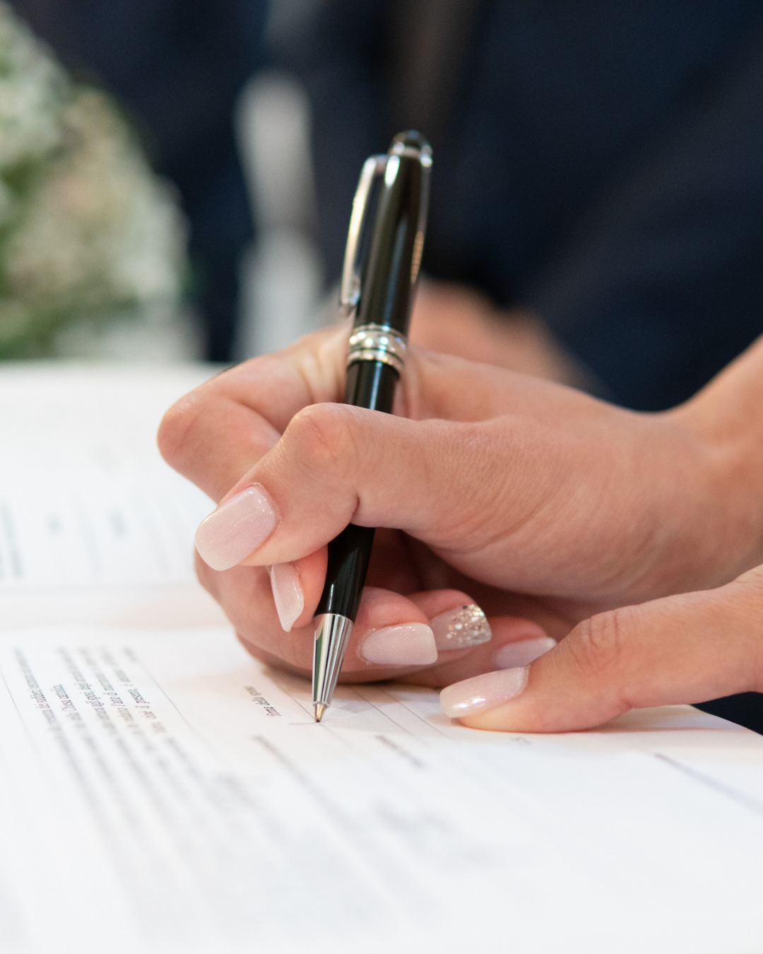 Signing the marriage certificate after the wedding ceremony